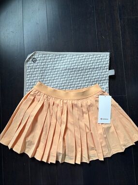 LULULEMON HIGH RISE PLEATED TENNIS SKIRT IN ROCK MELON SZ 6 NWT